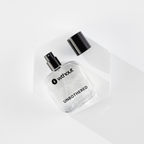Clear perfume bottle with black cap labeled 'without' on a white background